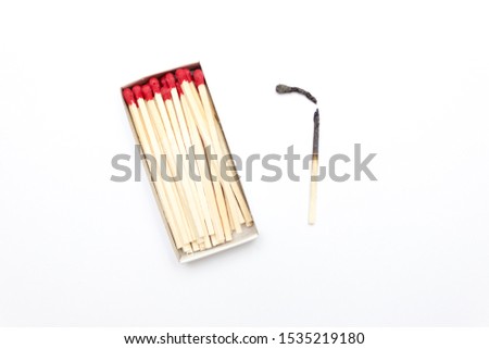 Matches in a box isolated, long matches, One burnt match Royalty-Free Stock Photo #1535219180