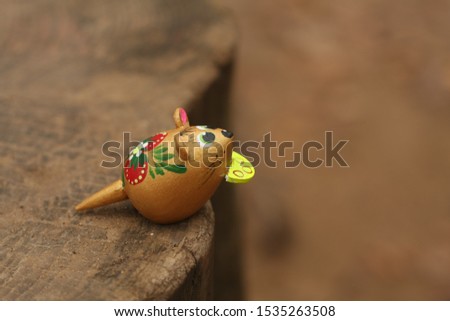 funny mouse on the edge of a cliff with cheese