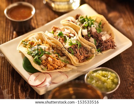 authentic mexican barbacoa, carnitas and chicken tacos Royalty-Free Stock Photo #153533516