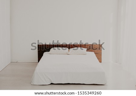 large bed in the Interior white bedrooms