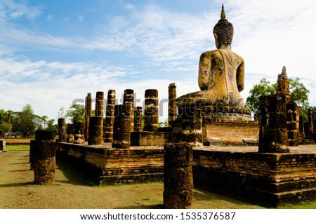 Sukhothai : Buddha statue and  The archaeological site at Wat Mahathat temple. Temple in Sukhothai historical park. UNESCO world heritage. Is one popular tourist destination in Sukhothai, Thailand.