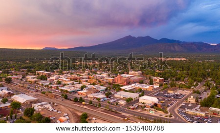 Blue and Orange color swirls around in the clouds at sunset over Flagstaff Arizona Royalty-Free Stock Photo #1535400788