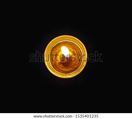 Top view shot of a oil lamp, isolated on black background Royalty-Free Stock Photo #1535401235