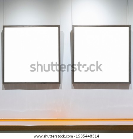 The empty frame on the wall on a white background