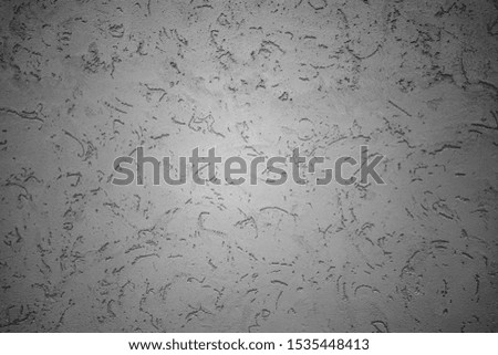 ROUGH DARK RELIEF STUCCO WALL TEXTURE BACKGROUND. BLANK FOR DESIGNERS
