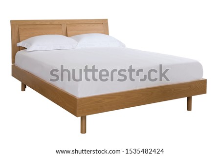 The wood bed with white bedding isolated on the white background. Royalty-Free Stock Photo #1535482424