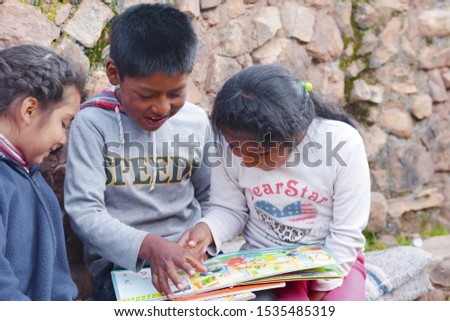 Native american kids reading a  book. Royalty-Free Stock Photo #1535485319