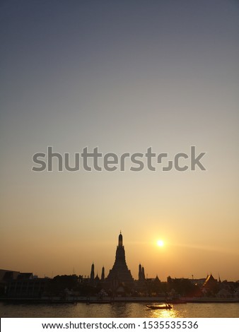 Wat Arun Temple at sunset in bangkok Thailand. Wat Arun is a Buddhist temple in Bangkok and among the best known of Thailand's landmarks