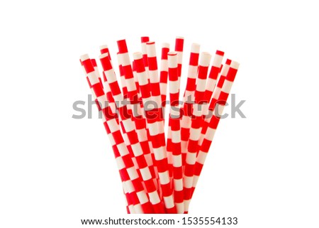 Paper straw of red colors on isolated background. Selective focus