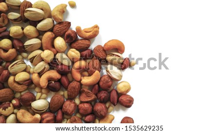 background in the form of different nuts on a white background Royalty-Free Stock Photo #1535629235