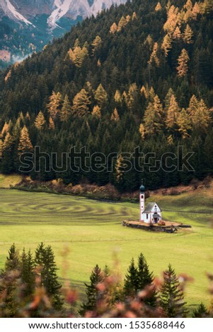 Autumn landscape in the Dolomites Alps, Trentino Alto Adige, Italy. Santa Maddalena Church