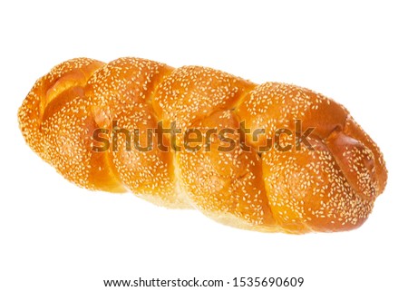 Braided challah with sesame seeds isolated on white background