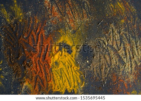 Picture of Scattered Indian Spices on Black Background.