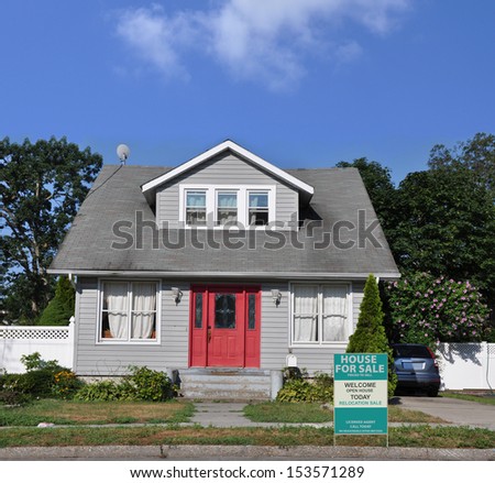 For Sale Real Estate Relocation Sign on Front Yard Curb Suburban Home Bungalow Style House Residential Neighborhood USA