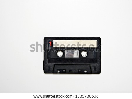 Retro black blank cassette tape on white background