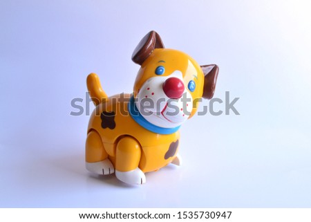 Children's toys made of plastic shaped cute animals. Toy dog shaped whole body with a white background.