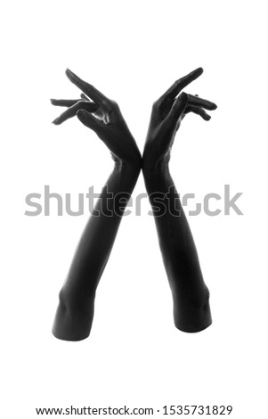 female hands painted in black color isolated on white background, monochrome