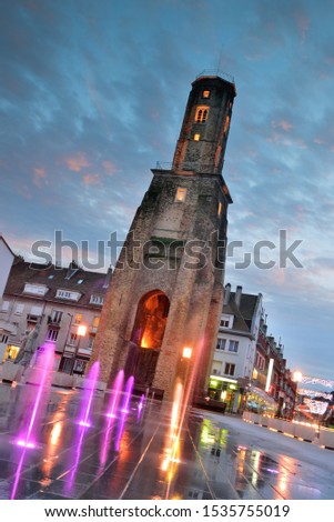 Tower on Calais town square at sunset Royalty-Free Stock Photo #1535755019