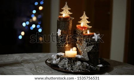 christmas time decoration with advent candle and christmas tree