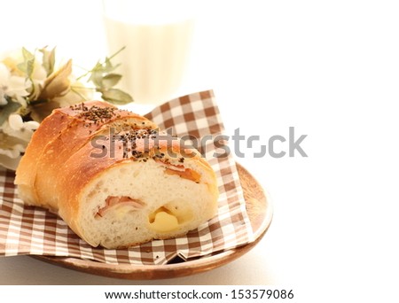 home bakery, cheese and bacon bread on brown checkered napkin