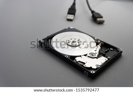 Close up of hard disk's internal mechanism hardware. Soft focus at middle and background. Royalty-Free Stock Photo #1535792477