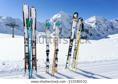 Skiing, winter season , mountains and ski equipments on ski run