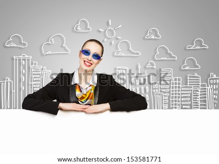 Image of young businesswoman wearing goggles and holding blank banner