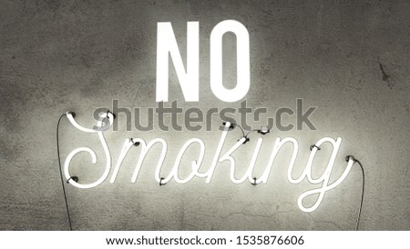 No smoking bright white neon sign on a concrete background, smoking ban.