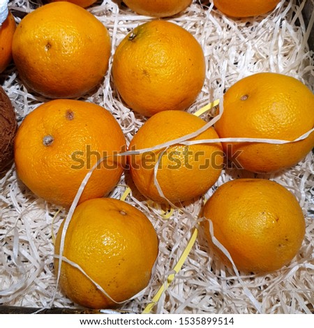 Macro Photography food product orange. Texture orange juicy orange fruit. Citrus fruit orange lies in the store.