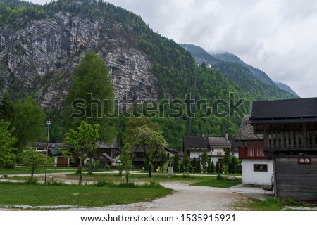 Camping area with mountain and a cloudy sky in background, picture from Hallstatt Austria.