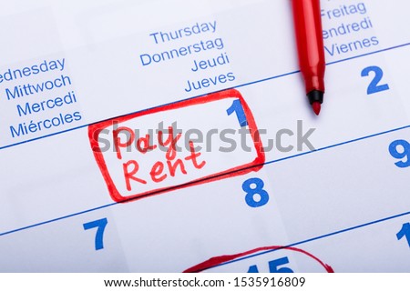 Pay Rent Note Made Using Red Marker In Paper Calendar Royalty-Free Stock Photo #1535916809
