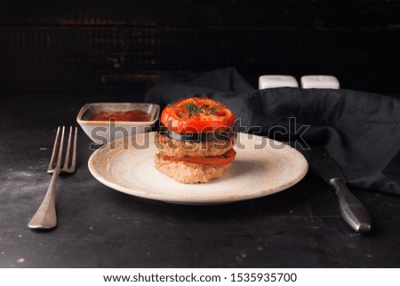 beef patties with tomatoes and eggplant