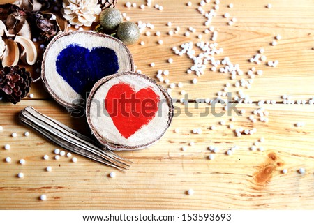 Two wooden hearts in a romantic christmas eve atmosphere