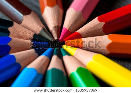 circle color concept photo pencils on a wooden table center