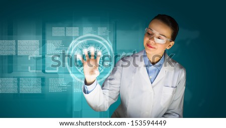 Image of young woman scientist in goggles against media screen
