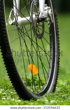 Bicycle wheel with cats eye Royalty-Free Stock Photo #153596633