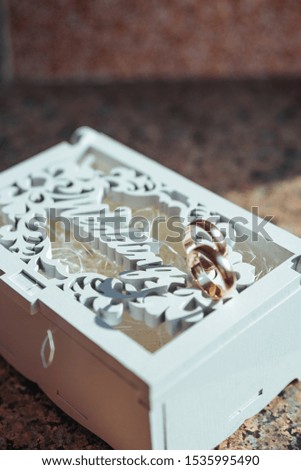 two wedding rings, Wedding rings on a wooden box