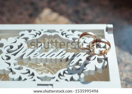 two wedding rings, Wedding rings on a wooden box
