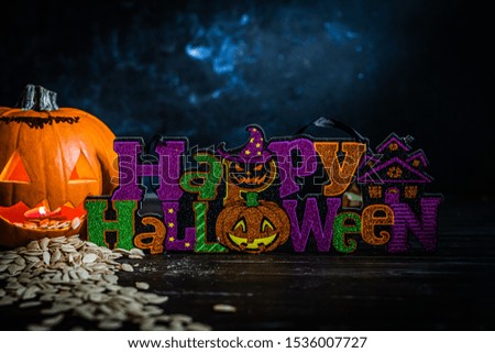 Halloween title with pumpkin, moonlight, dark background 