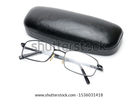 Transparent optical glasses with a eyeglass case on an isolated white background.