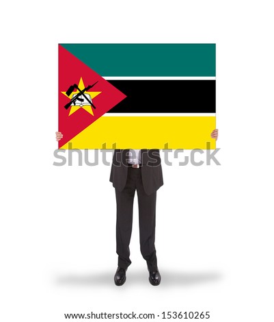Businessman holding a big card, flag of Mozambique, isolated on white