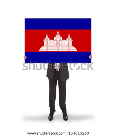 Businessman holding a big card, flag of Cambodia, isolated on white