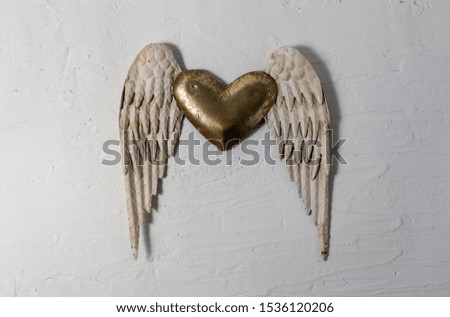 Craft made heart with wings, golden