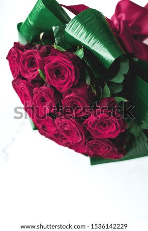 Gift for her, romantic relationship and floral design concept - Luxury bouquet of burgundy roses on marble background, beautiful flowers as holiday love present on Valentines Day