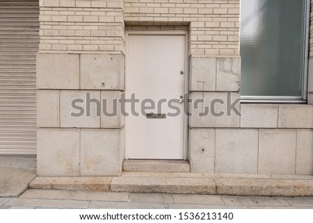 sidewalk by street wall & door
