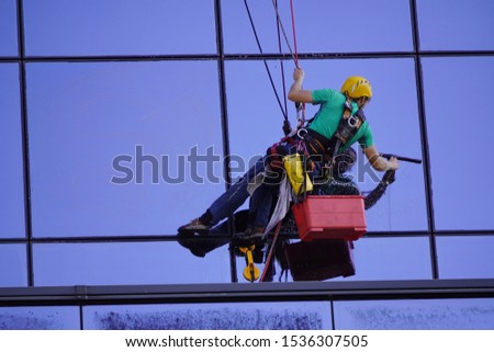 industrial climbing, cleaning of Windows, glass elements of the Royalty-Free Stock Photo #1536307505