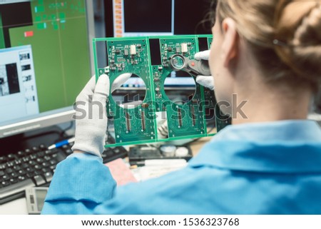 Optical quality control and assembly inspection of an electronic product in the factory Royalty-Free Stock Photo #1536323768