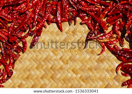 Dry chilies on threshing basket.