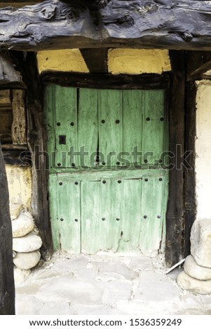 Wooden door with ancient lock, construction and architecture
