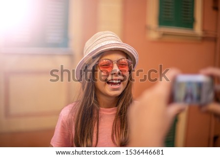 Shooting picture of a 9 years old female child , Photograph concept at the street